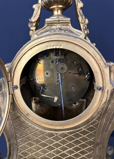 Louis XV-style clock in gilded bronze