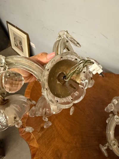 Three "Maria Teresa" three-light wall sconces, early 1900s, crystal, 18x30x20 cm. In good condition, complete.
