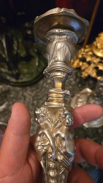 Pair of silvered bronze candlesticks decorated with putti, Napoleon III period, circa 1860-1880