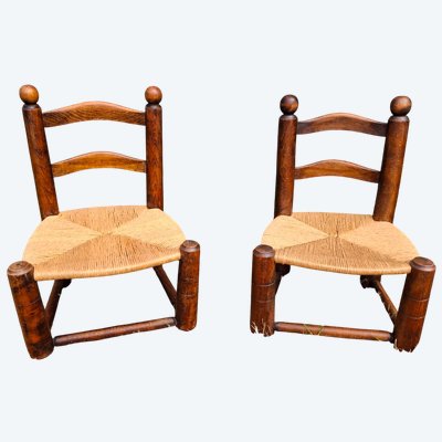 Pair of low Dudouyt chairs with straw seats