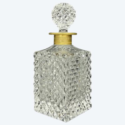 Cut crystal whiskey decanter with diamond-point decoration, gilded bronze base