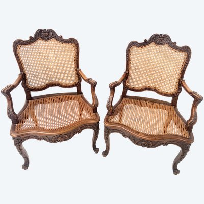 Paire de fauteuils de style Régence en bois naturel XIX siècle