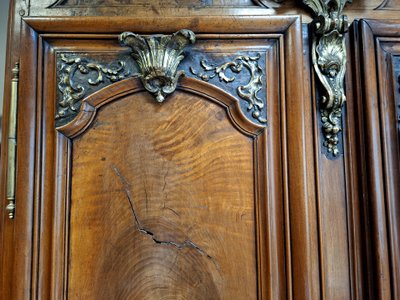 Richly molded and inlaid Louis XIV walnut cabinet – 18th century