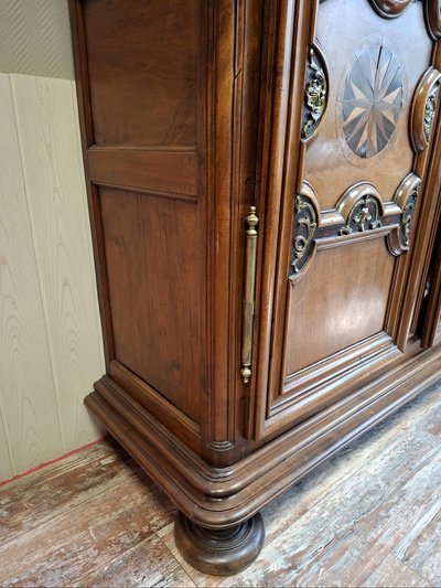 Richly molded and inlaid Louis XIV walnut cabinet – 18th century