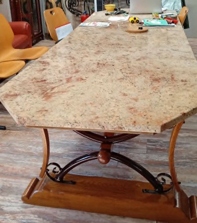 Large dining table made of polished granite with an oak and wrought-iron base 