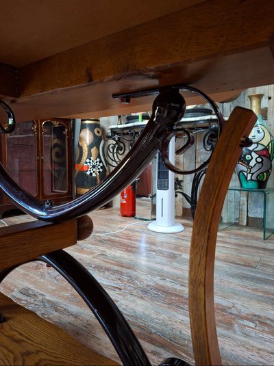 Large dining table made of polished granite with an oak and wrought-iron base 