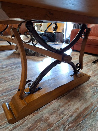 Large dining table made of polished granite with an oak and wrought-iron base 