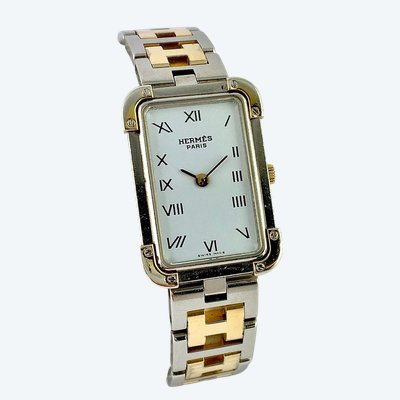 Hermès “Heure H” women’s watch in steel and gold-plated metal, quartz movement, circa 2015.