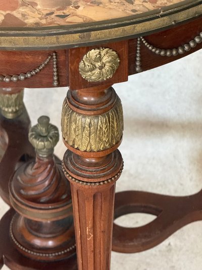 cracked marble pedestal table