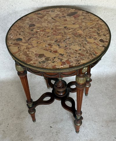 cracked marble pedestal table