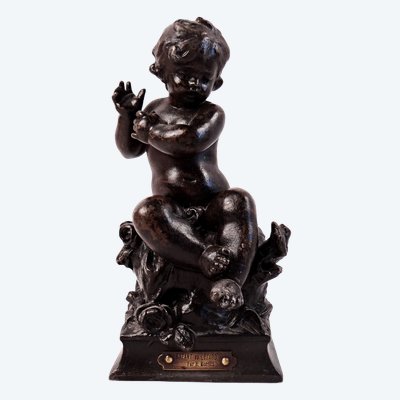 "The Child and the Lizard," a statuette in regul, with a brown patina, signed by Hyppolite Moreau, 19th century