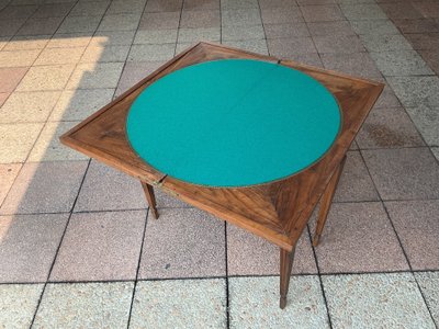 A Louis XVI-style eye table, made of walnut