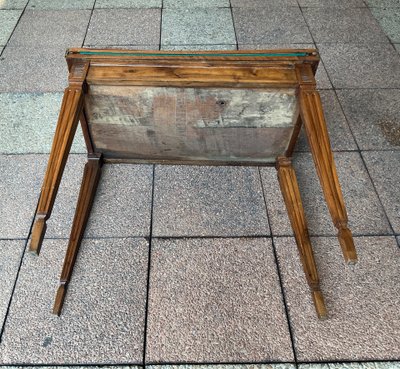A Louis XVI-style eye table, made of walnut