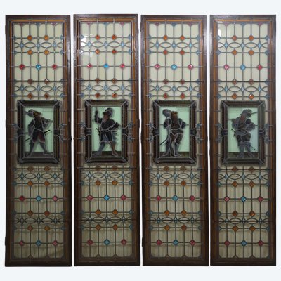 A set of four antique leaded-glass stained-glass windows from the late 19th century 