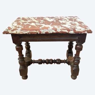 Small Louis XIII style office table in carved walnut with crimson marble top, 17th century