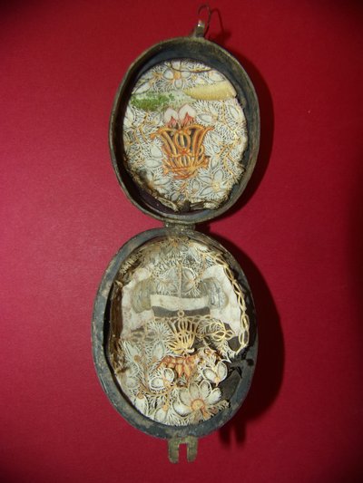 18th-century devotional reliquary with double painted enamel depicting Saint Peter and Saint Anne.
