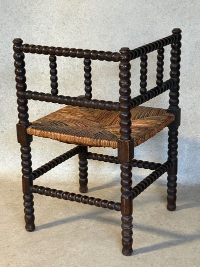 Fauteuil d’angle paillé
