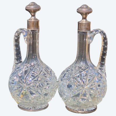 Pair of Baccarat crystal ewers with solid silver mounts, Minerva style, wine and water decanters