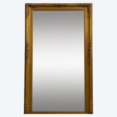 Empire period mirror in wood and gilded stucco, circa 1810-1820