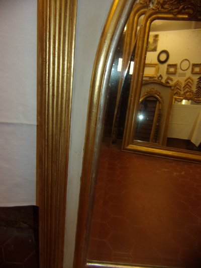 Specchio Art Déco in legno dorato e argentato, inizio XX secolo.