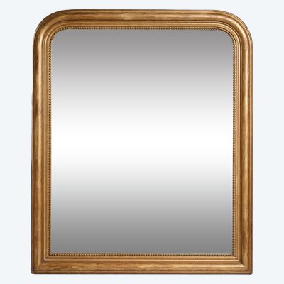 Large Louis Philippe period mirror in gilded wood