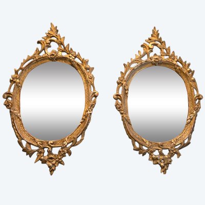 Pair of medallion mirrors, Italian work, second half of the 18th century.