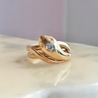 Vintage 18K yellow gold snake ring with a diamond