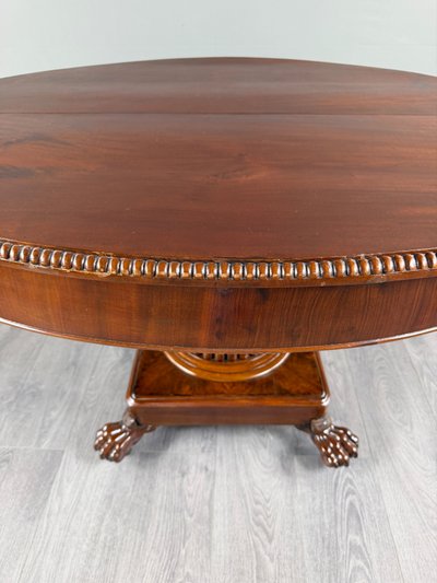 Table ovale de style Empire à pied central, XIXe siècle
