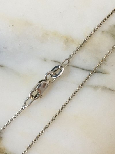 Set in 18K white gold with sapphire and diamonds