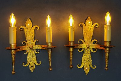 Pair of gilded wrought-iron Gothic wall sconces with built-in lighting