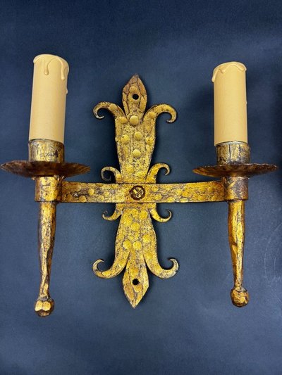 Pair of gilded wrought-iron Gothic wall sconces with built-in lighting
