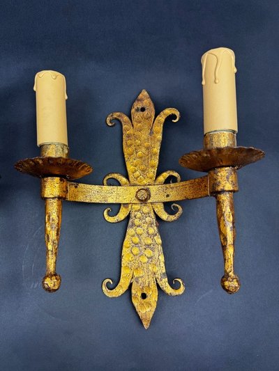 Pair of gilded wrought-iron Gothic wall sconces with built-in lighting