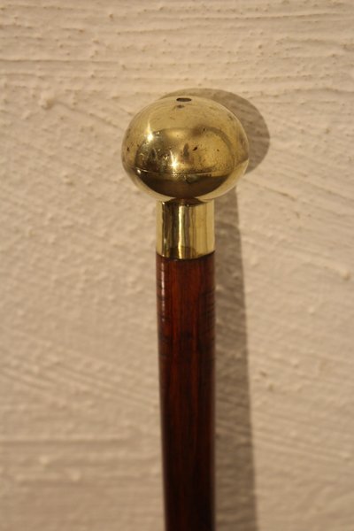 Decorative cane with a mechanism