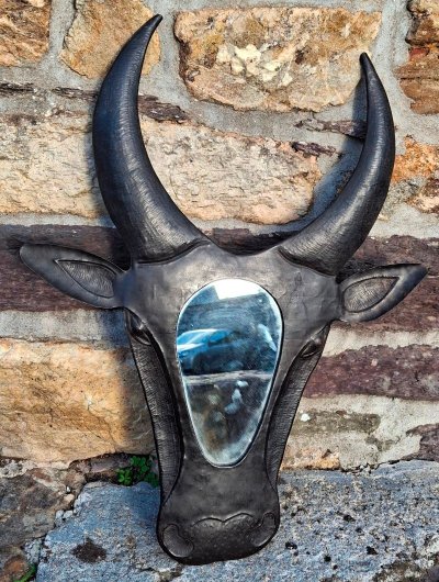 Metal mirror shaped like a cow's or bull's head