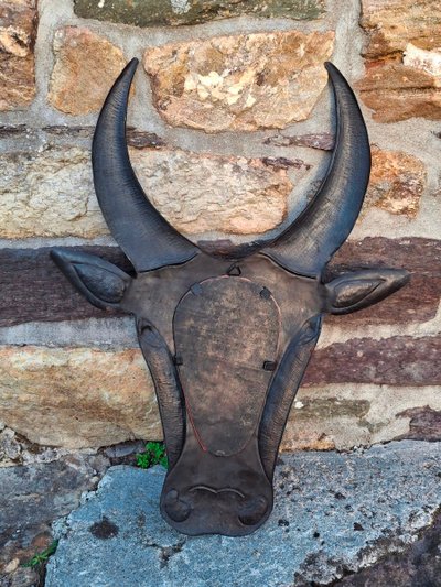 Metal mirror shaped like a cow's or bull's head