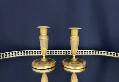 Pair of gilded brass candlesticks, Empire style