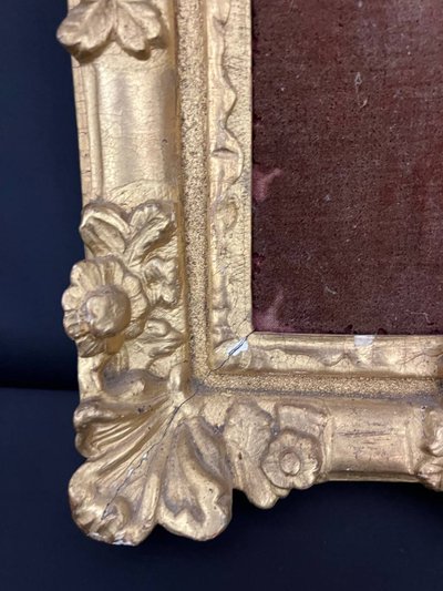 Antique carved and gilded wooden frame with floral decoration