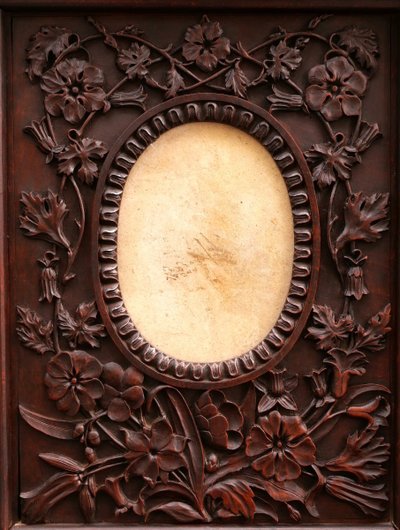 Richly carved, stained fruitwood oval picture frame, 19th century