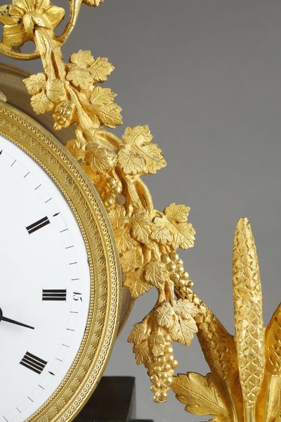 LARGE DIRECTOIRE CLOCK IN PATINATED AND GILT BRONZE