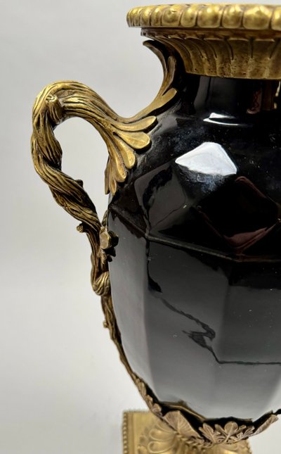 Large black ceramic vase with gilded bronze handles, 19th century.