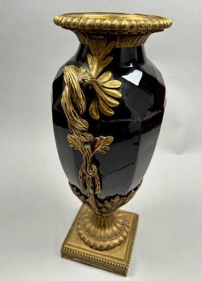 Large black ceramic vase with gilded bronze handles, 19th century.