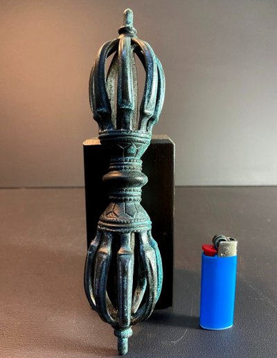 Tibet, Late 19th Century, oblong 9-pointed bronze vajra.