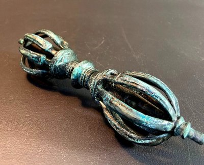 Tibet, Late 19th Century, oblong 9-pointed bronze vajra.