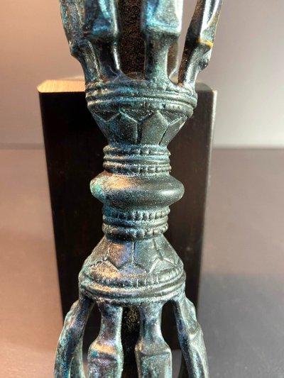Tibet, Late 19th Century, oblong 9-pointed bronze vajra.