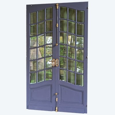 A pair of antique glass doors from the late 19th century with their original ironwork