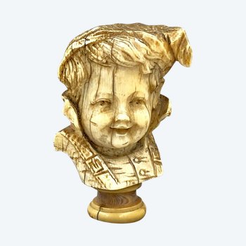 CANE KNOB carved in the round of a CHILD'S HEAD in costume