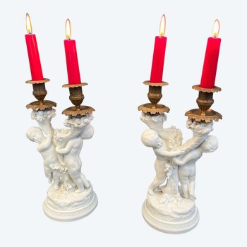 Pair of candlestick in cookie of Sevres with putti