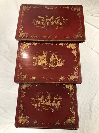 Set of three red lacquered nesting tables with gold decoration in the Asian style, 19th century