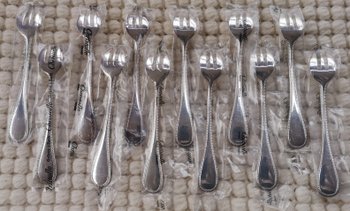 & 2 Christofle oyster forks, "Perles" model, silver plated