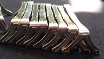 12 versilberte Messerhalter